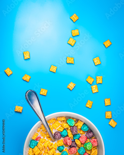 Colorful cereal on isolated blue background