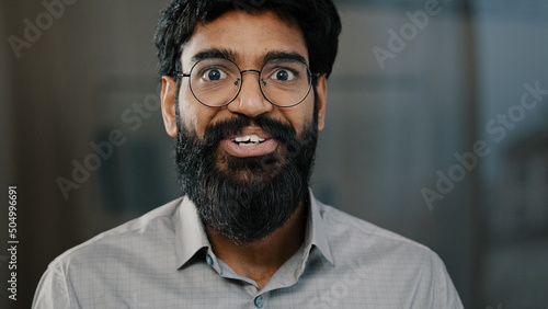 Male portrait surprise emotion enthusiastic surprised shocked arabian amazed man in eyeglasses make big eyes indian businessman winner demonstrate wow emotion face expression say wow happiness triumph