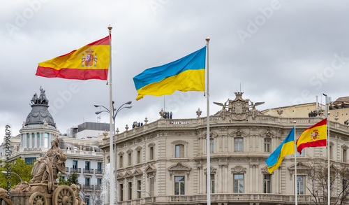 Fuente de Cibeles with Spanish and Ukrainian Flags photo