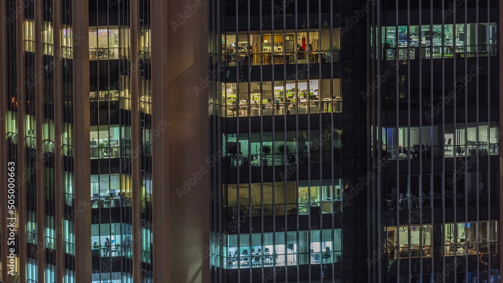 Windows lights in modern office buildings timelapse at night
