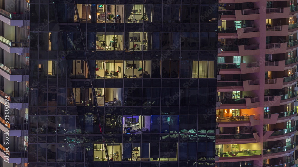 Windows lights in modern office and residential buildings timelapse at night Windows lights in modern office and residential buildings timelapse at night