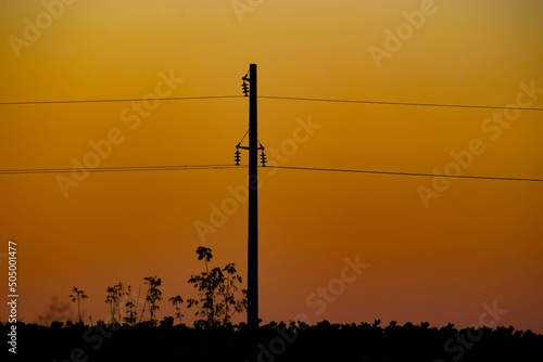 electric pole at sunset. Power line support