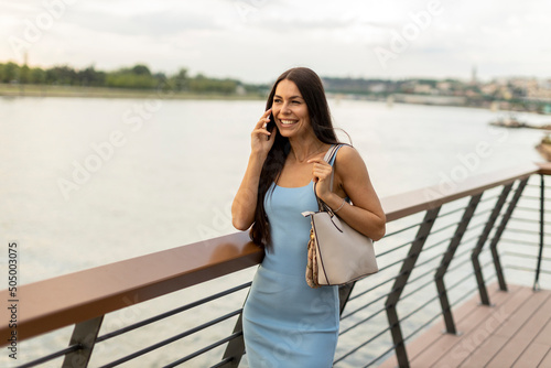 Young woman using a mobile ...