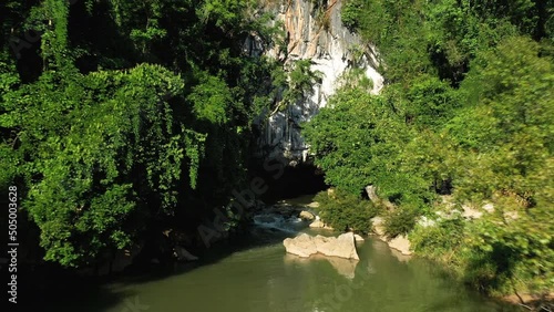 Top view Konglor cave hidden by rainforest in Asia, Laos, Khammouane, towards Thakek and Konglor, on a sunny day. photo