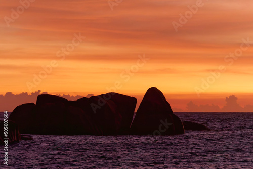 Serene sunset on Anse Takamaka beach, Mahe Island, Seychelles photo