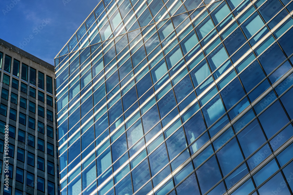 Windows on modern glass and steel skyscraper building - abstract business background Windows on modern glass and steel skyscraper building - abstract business background