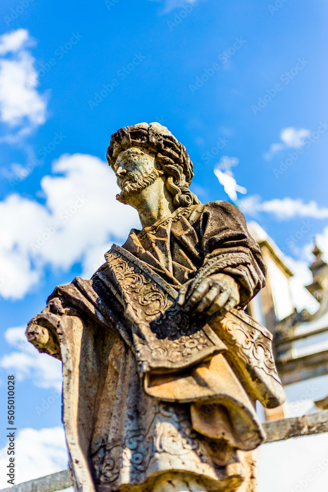 Obraz premium Statue of the prophet sculpted by Aleijadinho in front of the church of the sanctuary of Bom Jesus of Matosinhos at Congonhas, Minas Gerais, Brazil