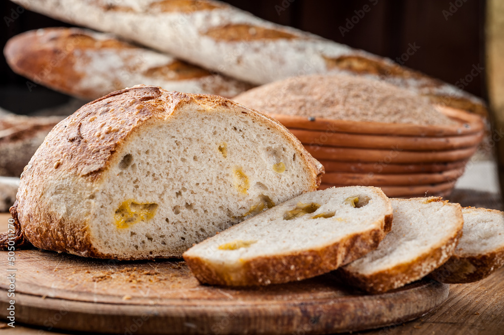 Bread. Baked bread. Craft bakery. Sliced bread on a wooden background. Food blog, food, pastries, flour, hot, fragrant, morning, fresh bread