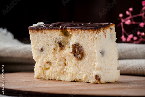 Cheesecake with raisins. Cheese dessert. cheese breakfast. Cafe. Dessert with raisins on a black background