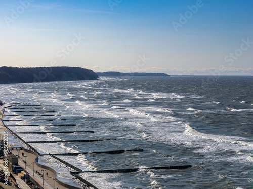 Top view on sea embankment with breakwaters on the sea with waves in Svetlogorsk Raushen, Kalinigrad region, Russia, near the Baltic sea.