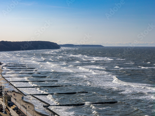 Top view on sea embankment with breakwaters on the sea with waves in Svetlogorsk Raushen, Kalinigrad region, Russia, near the Baltic sea. photo