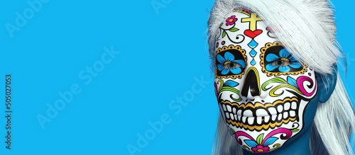 A beautiful view of 3d illustration with mexican skull painting on a 3d model. Gradient background.