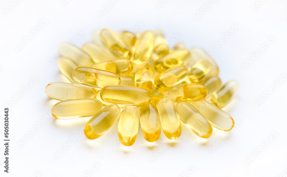 Omega-3 capsules on a white background. Polyunsaturated fatty acids. The concept of a healthy lifestyle Omega-3 capsules on a white background. Polyunsaturated fatty acids. The concept of a healthy lifestyle
