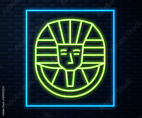 Glowing neon line Egyptian pharaoh icon isolated on brick wall background. Vector