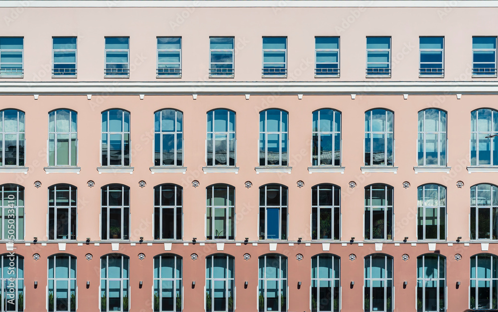 Building background. Front view of windows on colorful wall, modern architecture Building background. Front view of windows on colorful wall, modern architecture