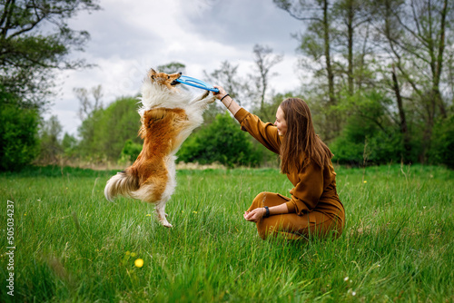 Фотография Interaction between dog and owner