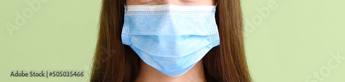 Young woman wearing medical...