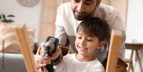 Father and little son fixin...