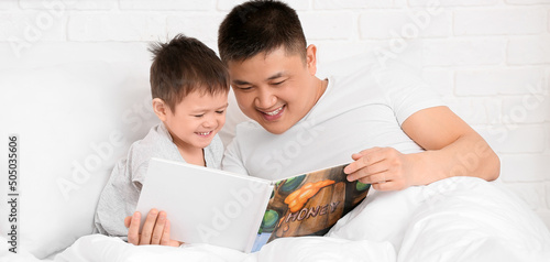 Asian man and his little so...