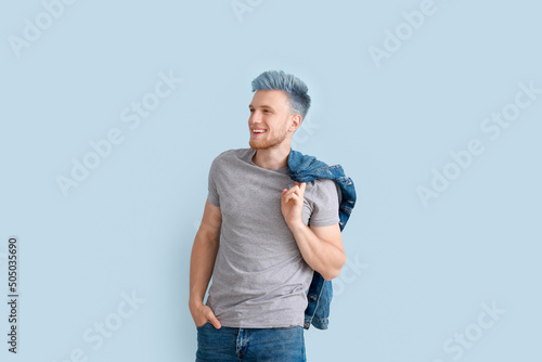 Stylish young man with unus...