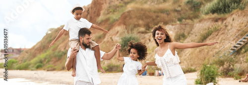 Happy interracial family on...