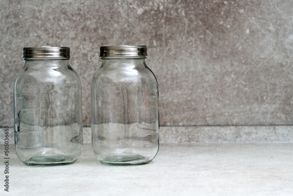 Two empty glass jars with lids for fermentation Two empty glass jars with lids for fermentation