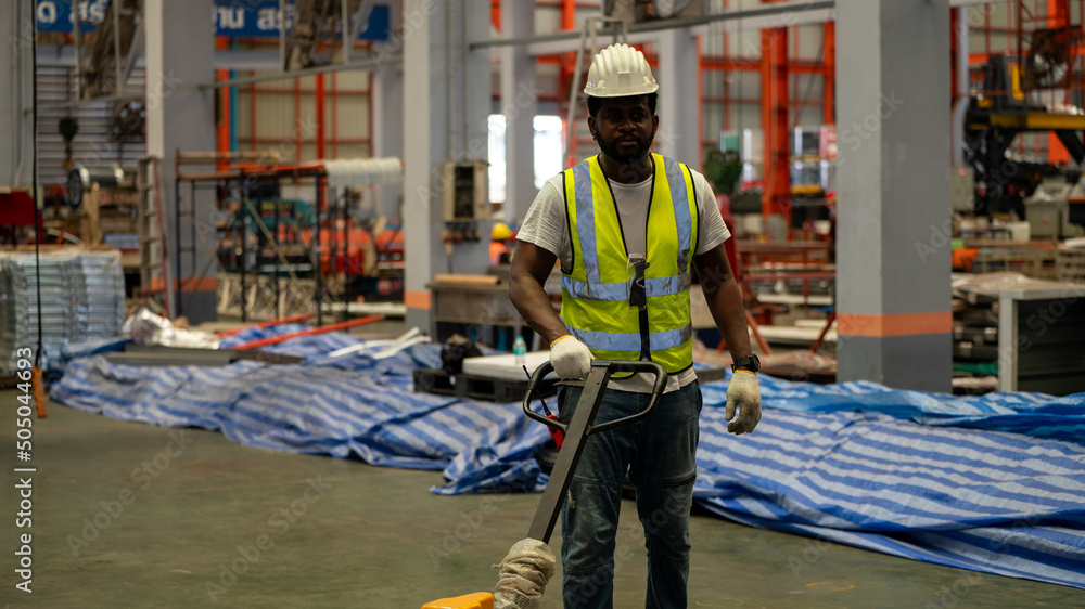 Diverse Team of Workers use Hand Pallet Truck Start Loading in Manufacturing Factory industry concept Diverse Team of Workers use Hand Pallet Truck Start Loading in Manufacturing Factory industry concept