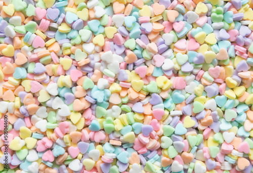 multicolor pastel  hearts hearts shaped sugar sprinkles background