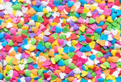 Multicolor  hearts hearts shaped sugar sprinkles background