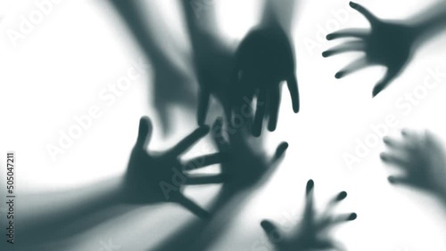 Shadow of a zombie hand on white background
 photo