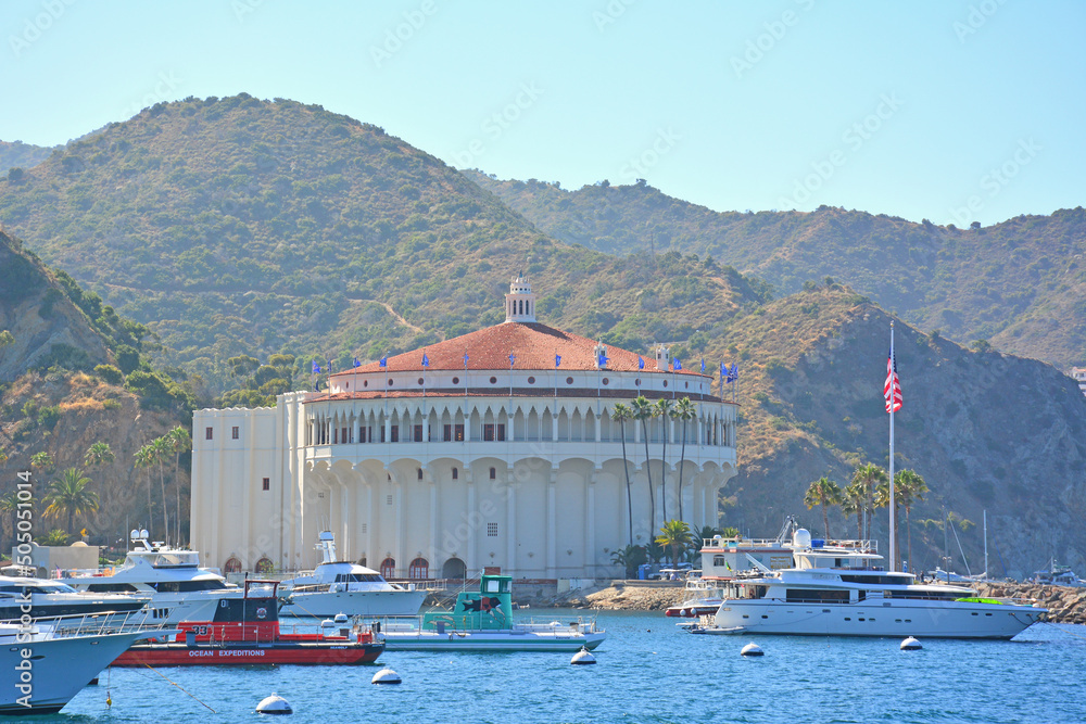 Casino with luxury boats anchored in Avalon Bay on Santa Catalina Island off the Southern California coast. 