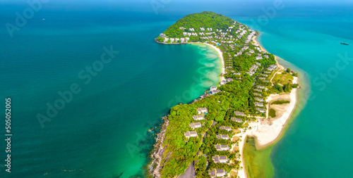 Small tropical island in the ocean with many resorts, aerial view of Ong Doi island in Phu Quoc, Kien Giang, Vietnam