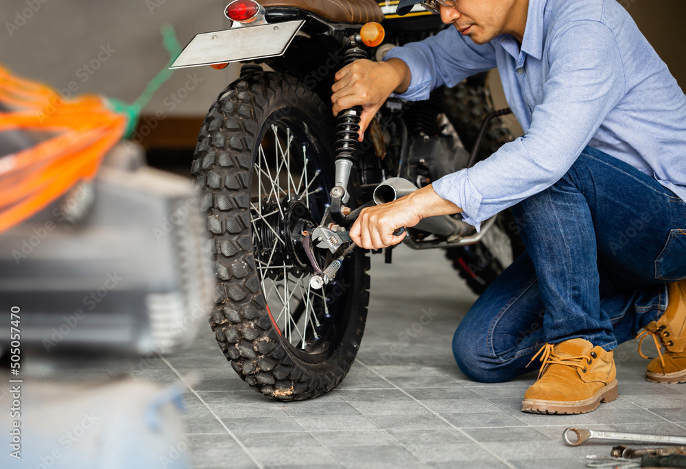 Ταπετσαρία Mechanic repairing motorcycle in repair shop, Man repair motobike in garage, mec