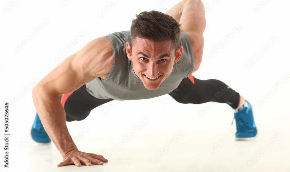 Strong man perform biceps and triceps workout at home without equipment Strong man perform biceps and triceps workout at home without equipment