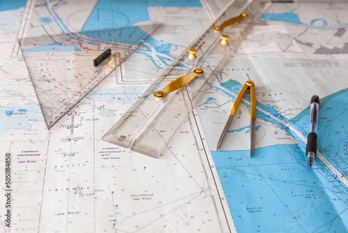 Navigation ship chart for building a sailing route. Plotter, divider, ruler and pen on a map.