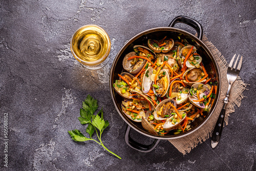 Shells vongole venus clams with vegetables and herbs