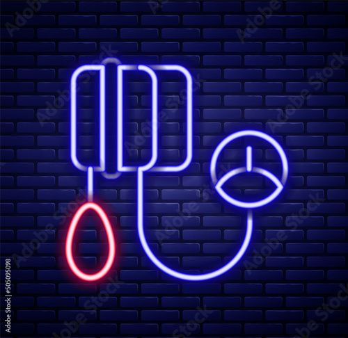 Glowing neon line Blood pressure icon isolated on brick wall background. Colorful outline concept. Vector