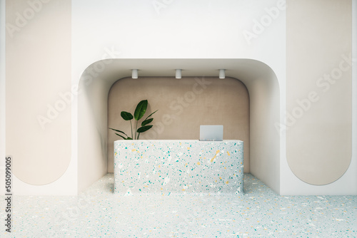 Multi-colored reception table with laptop in decorated niche of modern interior design office hall. 3D rendering, front view, mockup