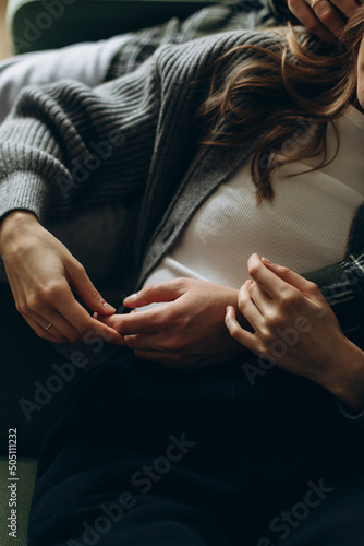 details of the embrace of a couple in love. hug together close up. gentle romantic embrace of a couple in casual clothes.