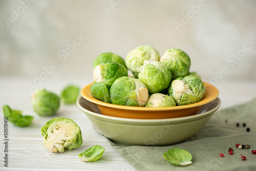 fresh washed brussels sprouts in a green bowl