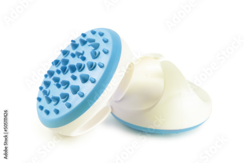 Hand massager with silicone spikes for anti-cellulite massage procedure isolated on white background. Massage brush tool for problem body zone, self-care, health care, body therapy.