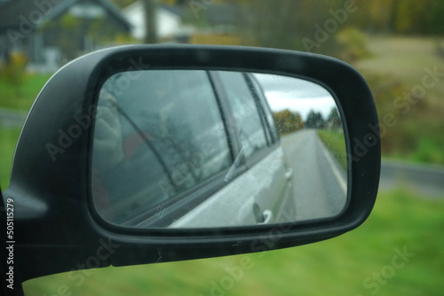 Side rear-view mirror on a car. © oleksandr