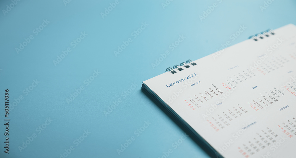Close top view on white calendar 2022 month schedule Work planning and life concept. Close top view on white calendar 2022 month schedule Work planning and life concept.