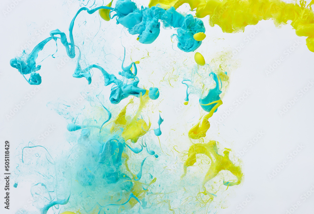 Splash of blue and yellow ink. Ukraine flag colors abstract background