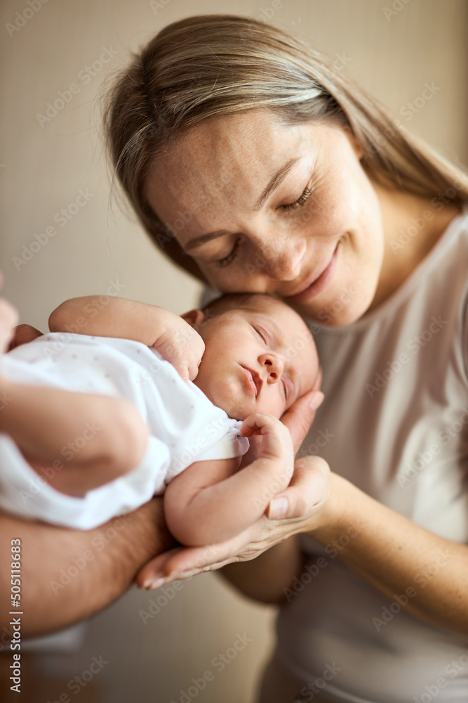 Close-up of happy young mother holding newborn baby Close-up of happy young mother holding newborn baby