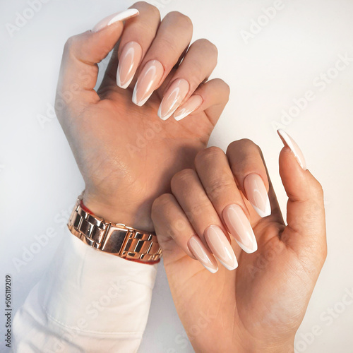 Valokuva Gentle camouflage gel polish on long square nails with a French design