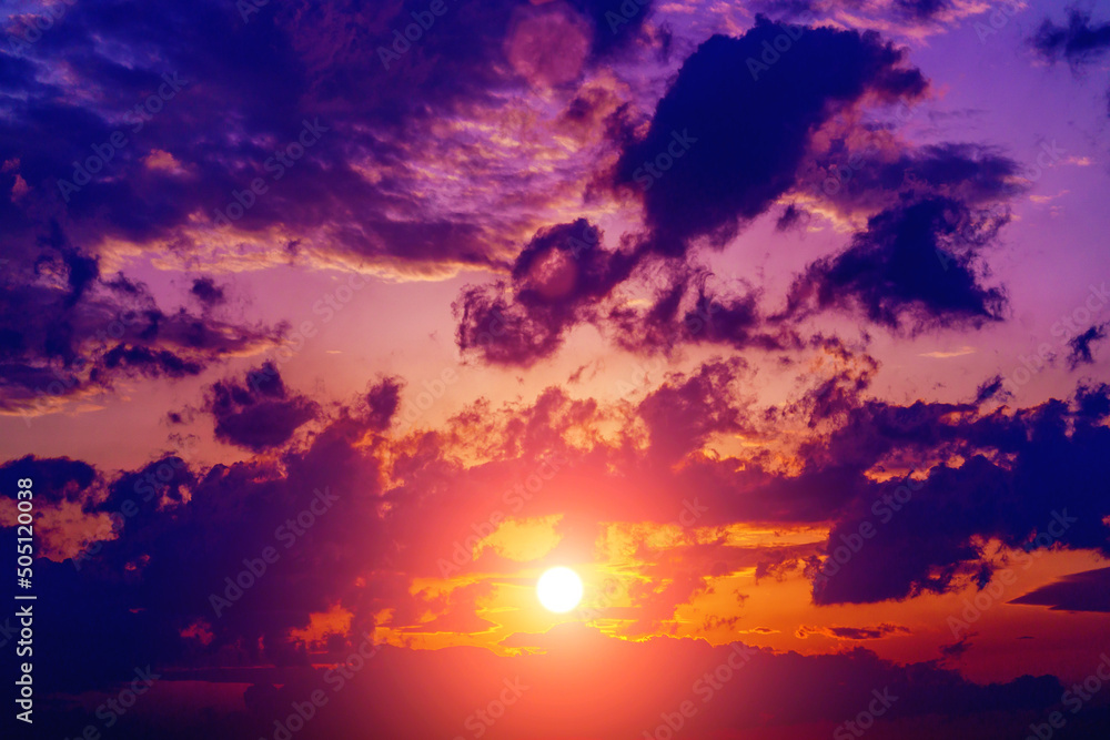 Great dramatic view. Amazing sky panorama. Clouds illuminated by the setting sun. Meditative calmness and greatness. Colorful sunset in the evening sky. Red sun in the clouds Great dramatic view. Amazing sky panorama. Clouds illuminated by the setting sun. Meditative calmness and greatness. Colorful sunset in the evening sky. Red sun in the clouds