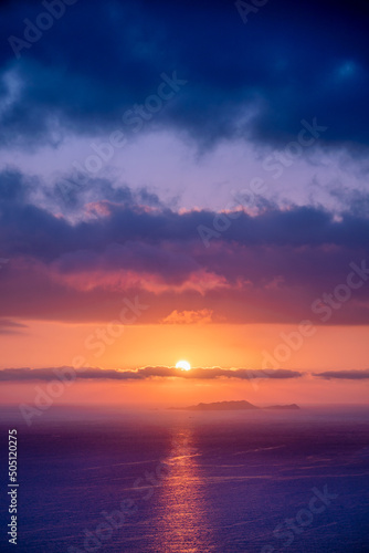 Colorful sunset in the evening sky. Great dramatic view. Amazing sky panorama. Meditative calmness and greatness. Red sun in the clouds. Clouds illuminated by the setting sun