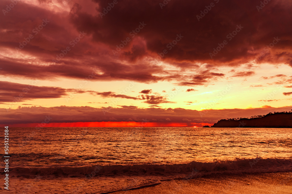 Great dramatic view. Amazing sky panorama. Clouds illuminated by the setting sun. Meditative calmness and greatness. Mystical lighting. Colorful sunset in the evening sky
