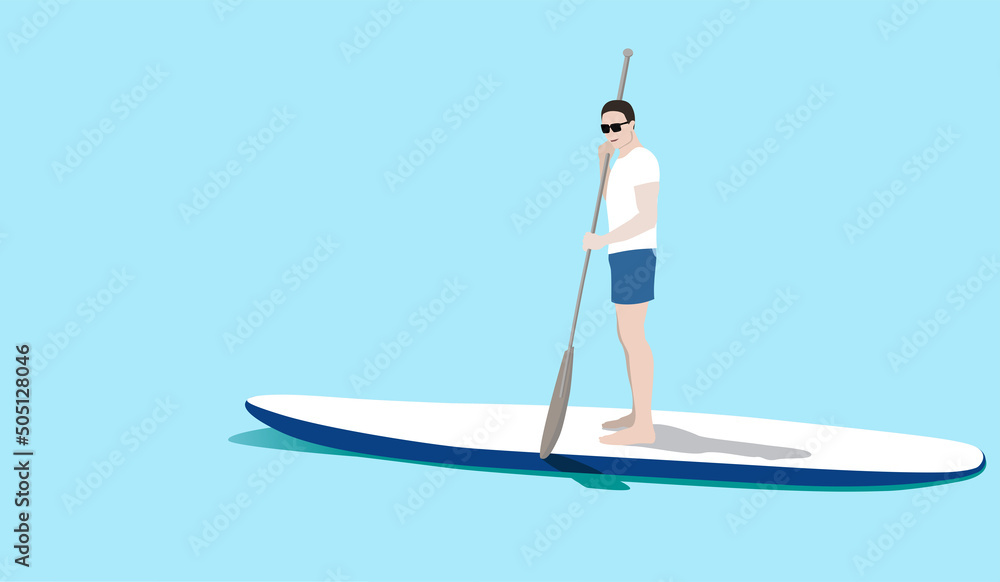 Young man standing on sup board floating in sea in sunny day. Tourist learning to paddle and balance on paddle board.